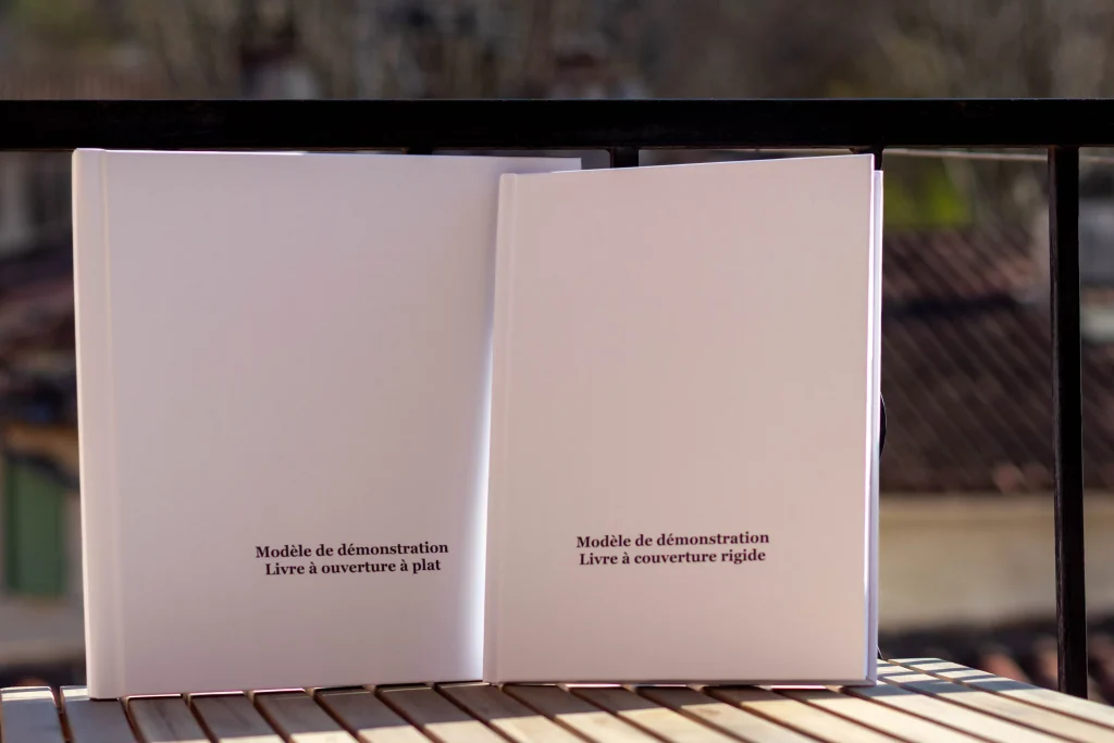 Demo models of a hardcover wedding album and a layflat wedding album