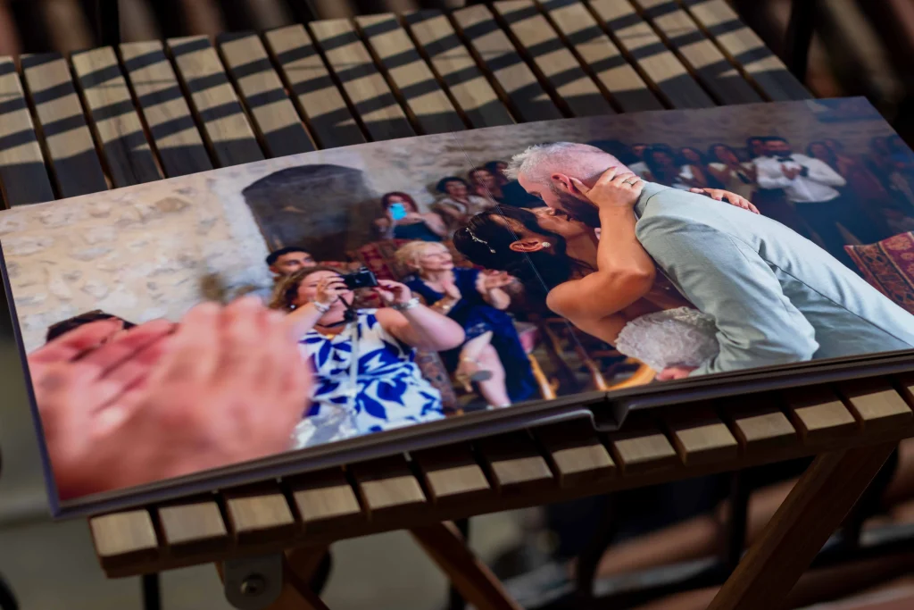 Layflat wedding album spread showing a ceremony moment