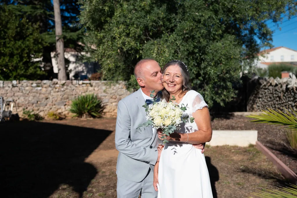 Wedding first look in Rougiers in the Var, the groom kisses the bride after seeing her for the first time