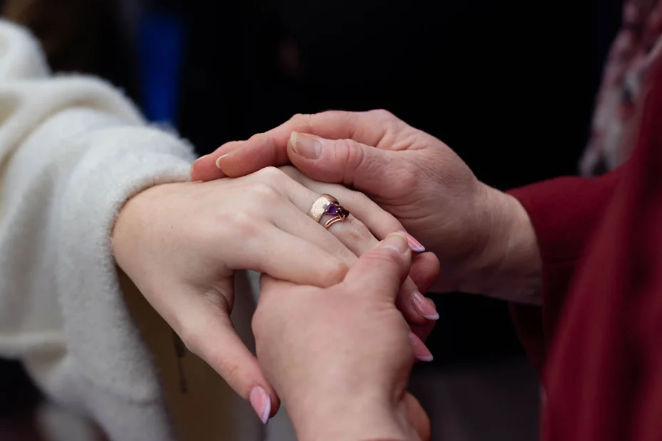 Bride’s hand with her wedding ring held by her mother during a wedding in Rousset, Provence