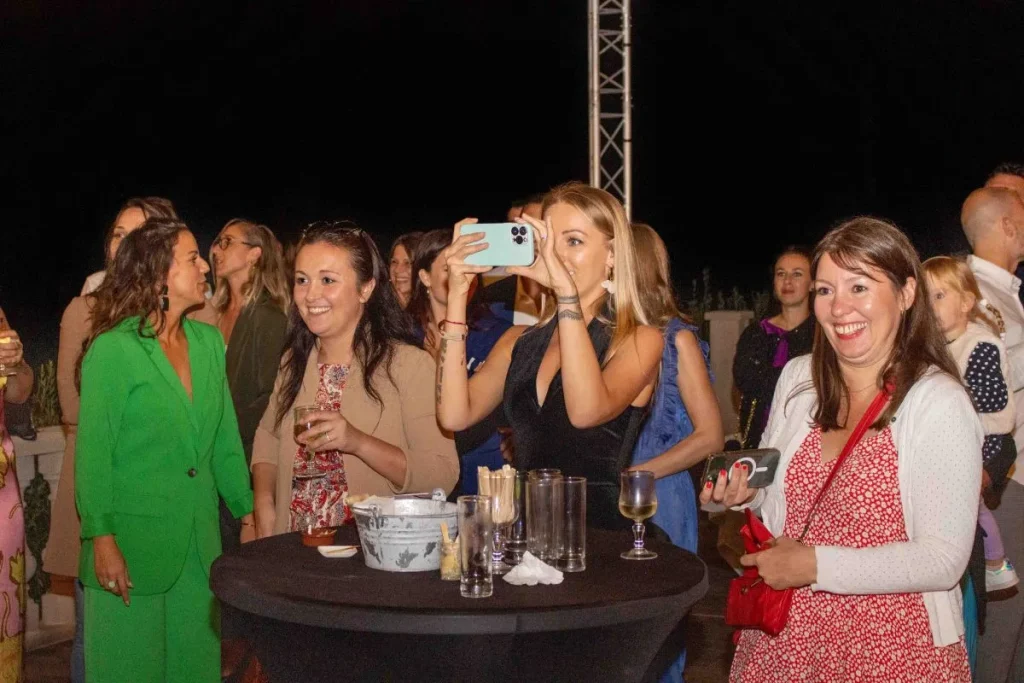 Smiling wedding guests during an evening reception in Trets, Provence
