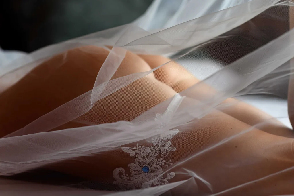 Close-up of the lace veil during a bridal boudoir session
